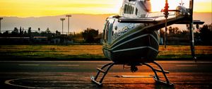 Preview wallpaper helicopter, sunset, airfield