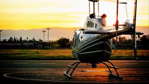 Preview wallpaper helicopter, sunset, airfield