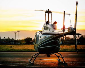 Preview wallpaper helicopter, sunset, airfield