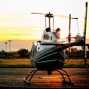 Preview wallpaper helicopter, sunset, airfield