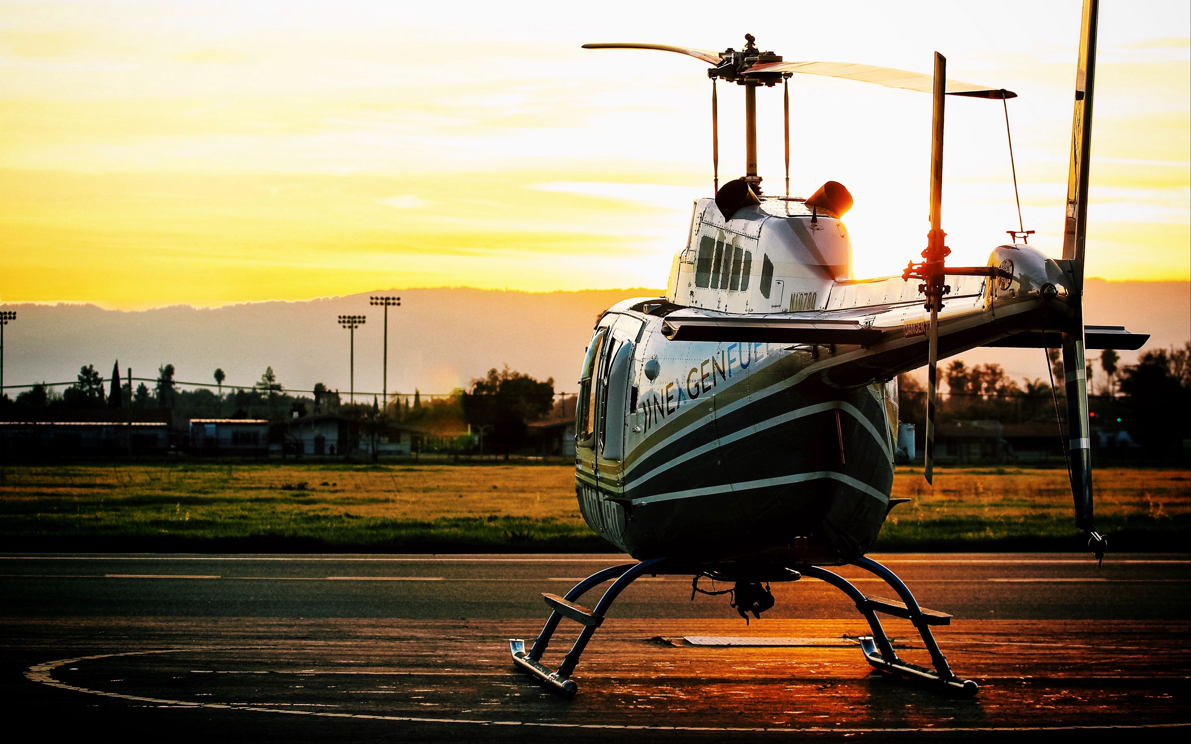 Download wallpaper 3840x2400 helicopter, sunset, airfield 4k ultra hd 16:10  hd background
