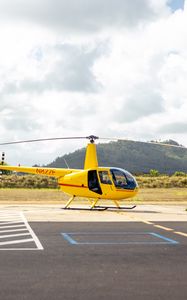 Preview wallpaper helicopter, yellow, asphalt, hill