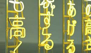 Preview wallpaper hieroglyphs, inscription, backlight, neon, yellow