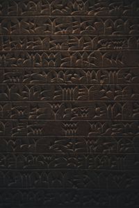 Preview wallpaper hieroglyphs, inscription, wall, texture, dark