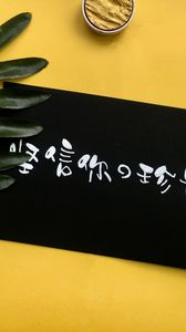 Preview wallpaper hieroglyphs, inscription, words, leaves, yellow