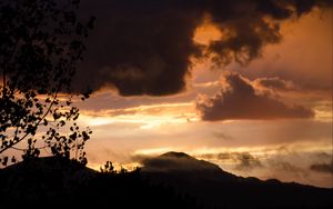 Preview wallpaper hill, clouds, smoke, silhouette