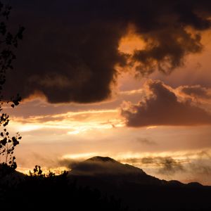 Preview wallpaper hill, clouds, smoke, silhouette