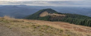 Preview wallpaper hill, field, mountains, landscape