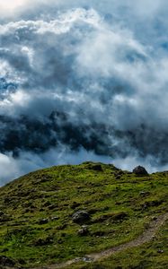 Preview wallpaper hill, field, stones, clouds, sky, landscape