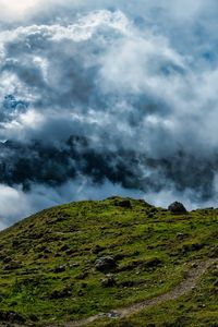 Preview wallpaper hill, field, stones, clouds, sky, landscape