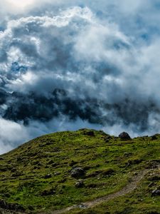 Preview wallpaper hill, field, stones, clouds, sky, landscape