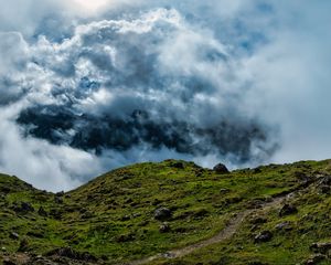 Preview wallpaper hill, field, stones, clouds, sky, landscape