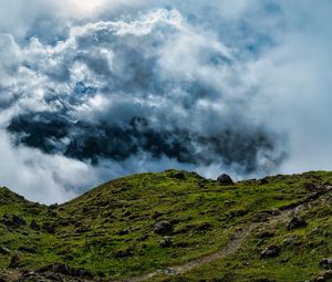 Preview wallpaper hill, field, stones, clouds, sky, landscape