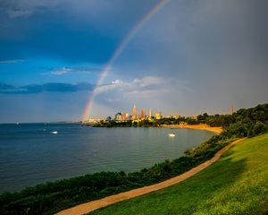 Preview wallpaper hill, field, water, rainbow, buildings, landscape