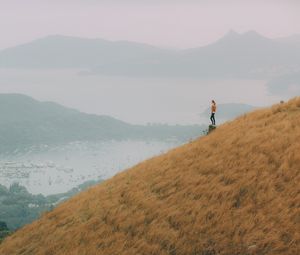 Preview wallpaper hill, girl, view, bay, fog