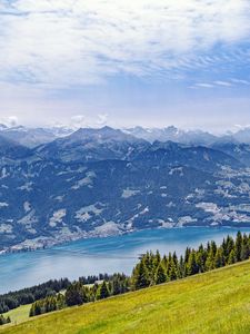 Preview wallpaper hill, grass, mountains, sea, clouds, nature