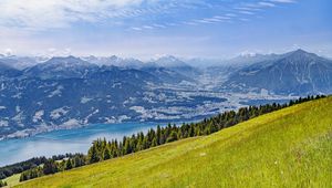 Preview wallpaper hill, grass, mountains, sea, clouds, nature