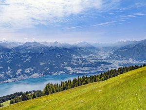 Preview wallpaper hill, grass, mountains, sea, clouds, nature