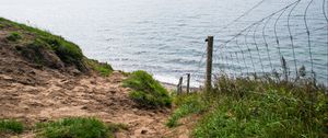 Preview wallpaper hill, grass, sea, fence, grid, view