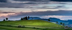 Preview wallpaper hill, grass, trees, road, sky