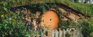 Preview wallpaper hill, house, cave, door, flowers