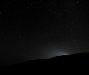 Preview wallpaper hill, light, starry sky, night, dark