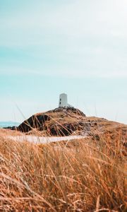 Preview wallpaper hill, lighthouse, grass, coast, nature