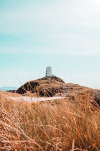 Preview wallpaper hill, lighthouse, grass, coast, nature