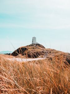 Preview wallpaper hill, lighthouse, grass, coast, nature