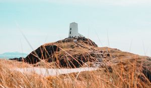Preview wallpaper hill, lighthouse, grass, coast, nature