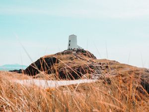 Preview wallpaper hill, lighthouse, grass, coast, nature