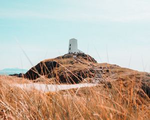 Preview wallpaper hill, lighthouse, grass, coast, nature