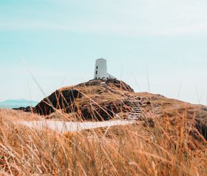 Preview wallpaper hill, lighthouse, grass, coast, nature