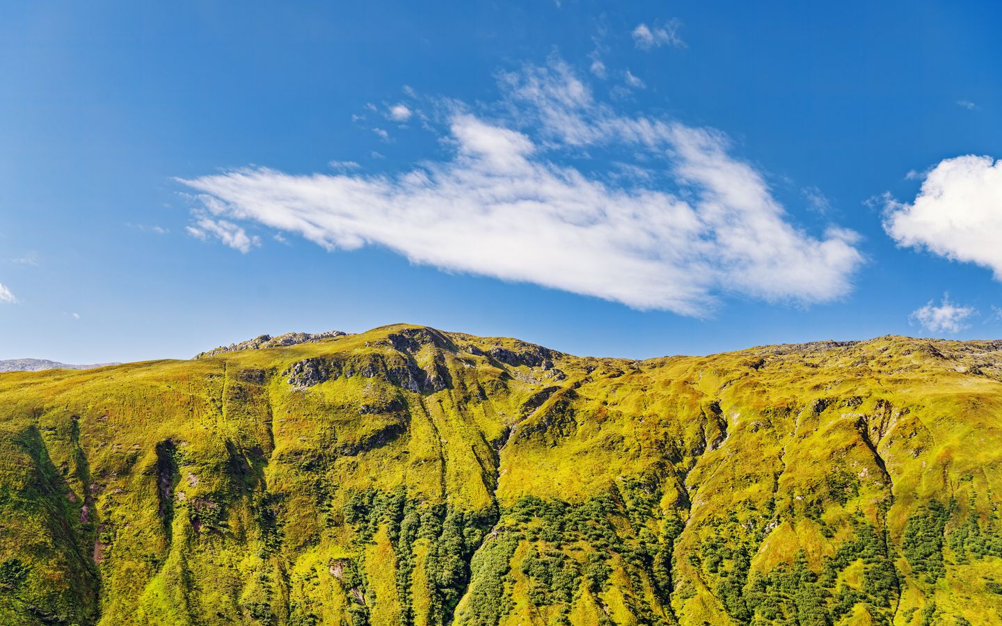 1440x900 Wallpaper hill, mountain, relief, grass, landscape, sky