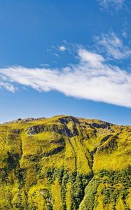 Preview wallpaper hill, mountain, relief, grass, landscape, sky