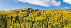 Preview wallpaper hill, mountain, relief, grass, landscape, sky