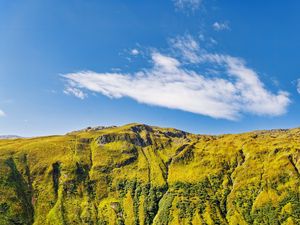 Preview wallpaper hill, mountain, relief, grass, landscape, sky