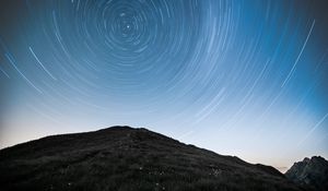 Preview wallpaper hill, mountains, starry sky, long exposure, stars, motion