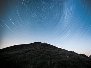 Preview wallpaper hill, mountains, starry sky, long exposure, stars, motion