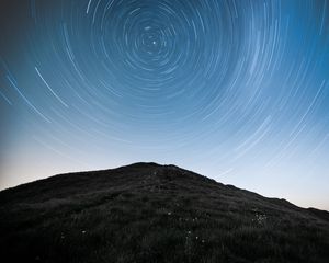 Preview wallpaper hill, mountains, starry sky, long exposure, stars, motion