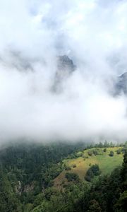 Preview wallpaper hill, mountains, trees, fog, clouds, landscape