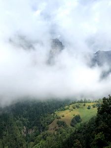 Preview wallpaper hill, mountains, trees, fog, clouds, landscape