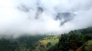 Preview wallpaper hill, mountains, trees, fog, clouds, landscape