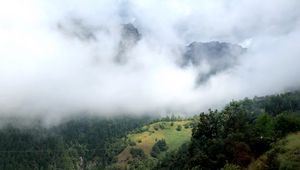 Preview wallpaper hill, mountains, trees, fog, clouds, landscape