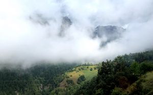 Preview wallpaper hill, mountains, trees, fog, clouds, landscape