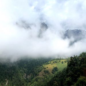 Preview wallpaper hill, mountains, trees, fog, clouds, landscape