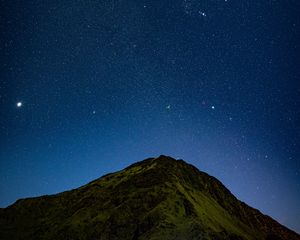 Preview wallpaper hill, night, starry sky, stars, relief