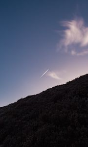 Preview wallpaper hill, plane, trail, smoke, sky