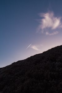 Preview wallpaper hill, plane, trail, smoke, sky