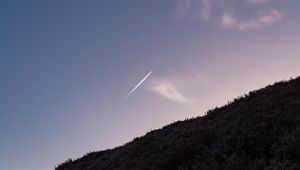 Preview wallpaper hill, plane, trail, smoke, sky